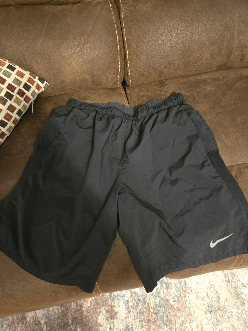 Nike Men's Black Athletic Shorts with Silver Swoosh Accent